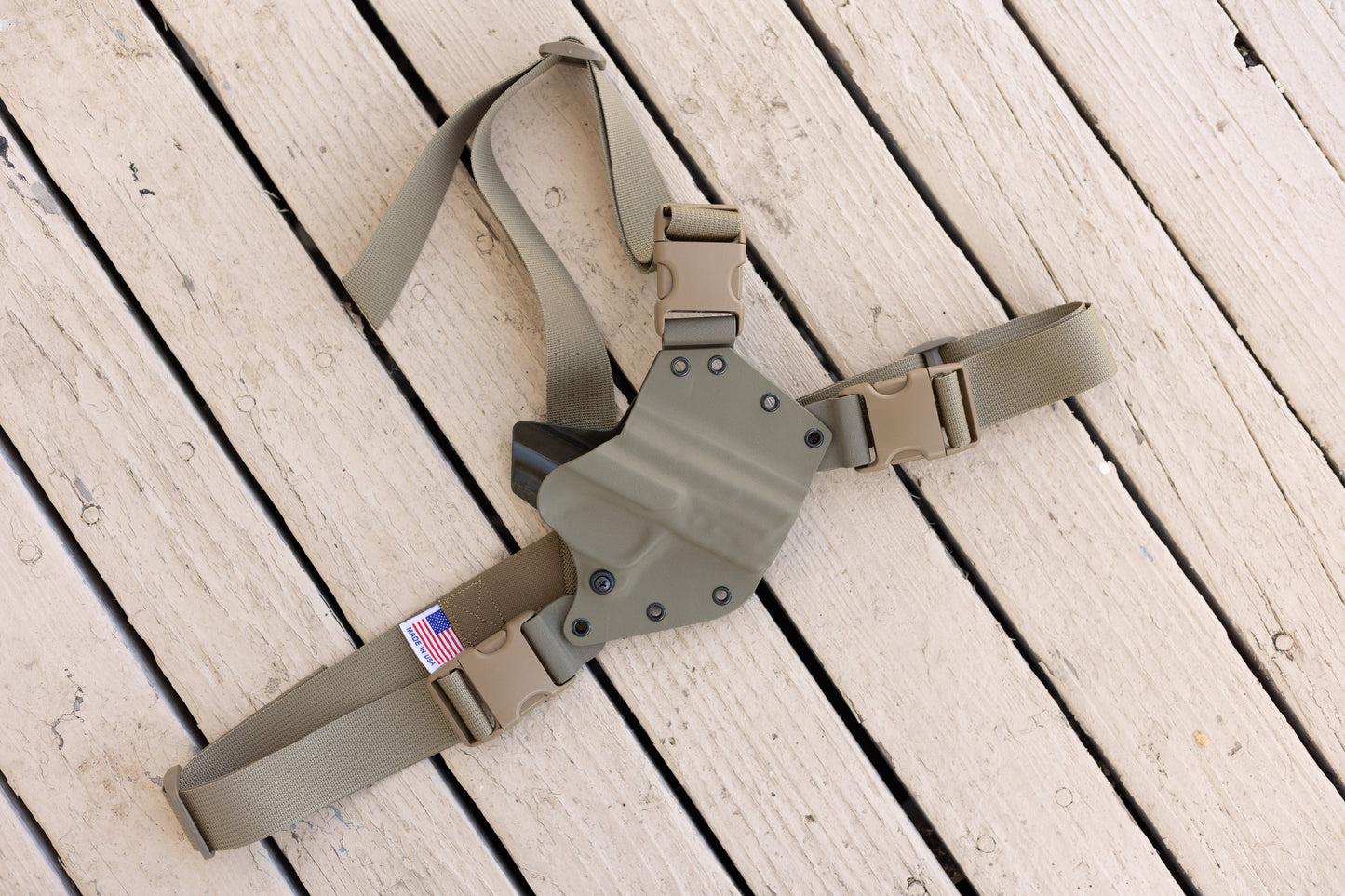 A FDE Arctos Arms across the chest holster for a S&W M&P 2.0 10mm pistol with Made in The USA printed on the harness