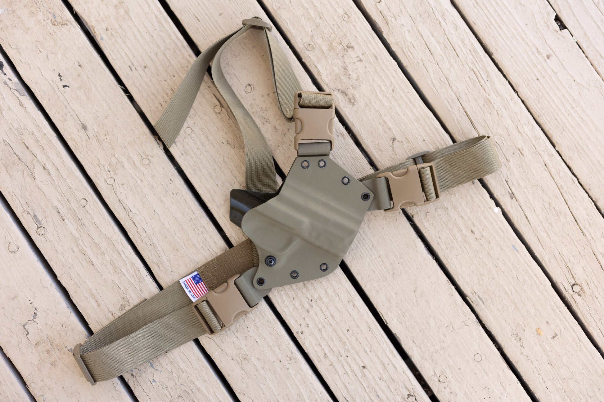 A FDE Arctos Arms across the chest holster for a S&W M&P 2.0 10mm pistol with Made in The USA printed on the harness