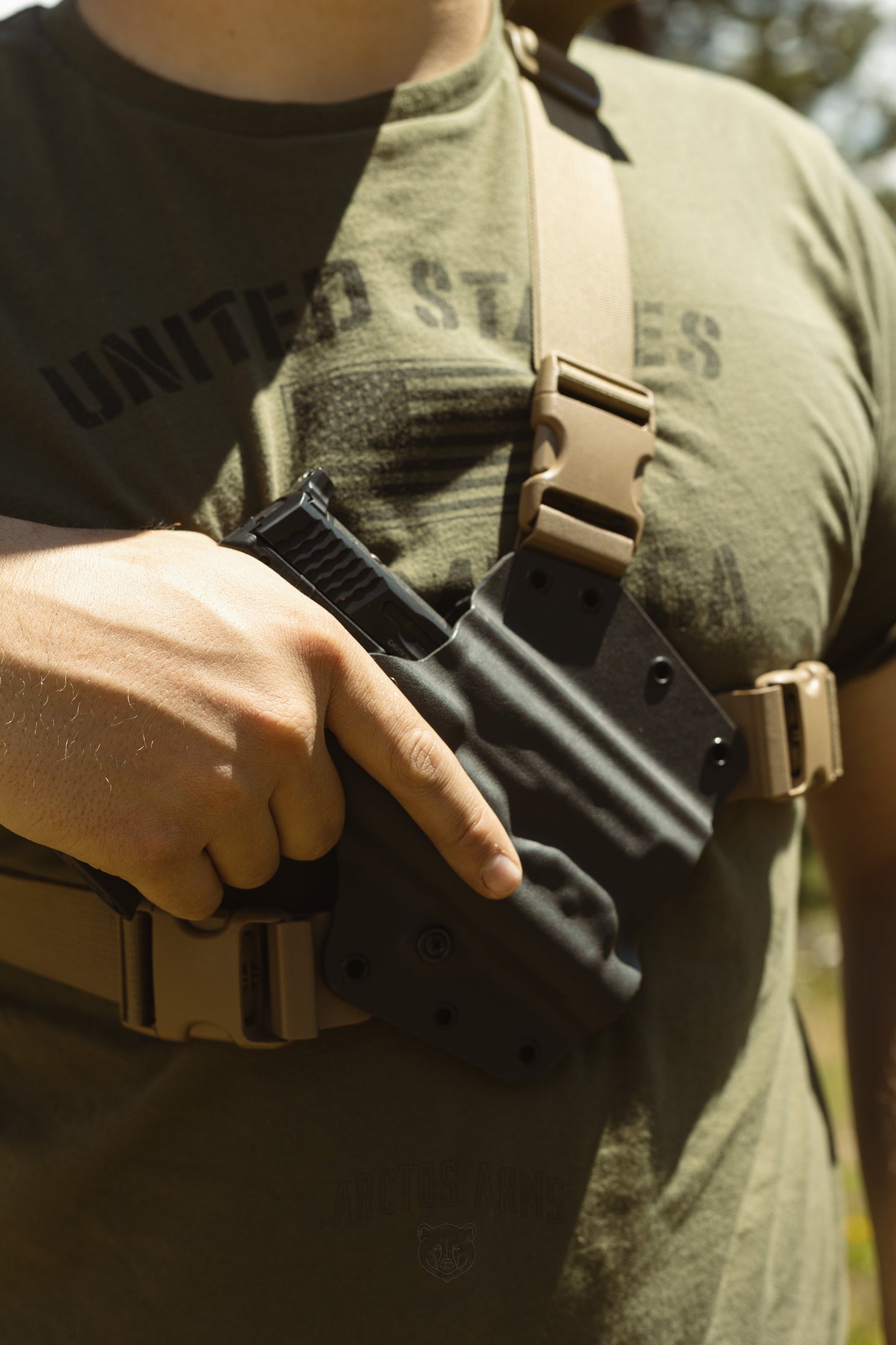 The best chest holster options for any outdoor need, the Arctos Arms chest holster pictured in grey.