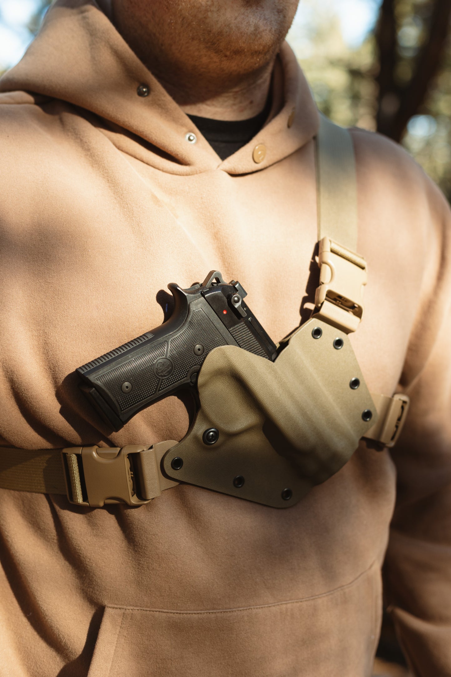 Beretta 92x Centurion (black) in a FDE Arctos Arms Chest Holster.